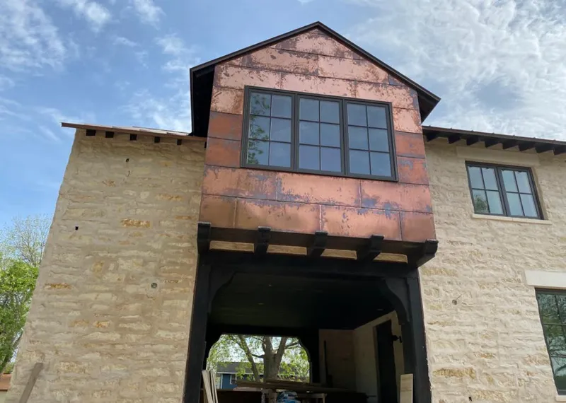 Copper metal panel facade on a stone building for Skylight Installation in Fort Lee
